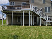 <b>Trex Transcend Lava Rock Decking with White Washington Vinyl with Black Round Aluminum Balusters-White Vinyl Wrap around deck, beams and support posts</b>